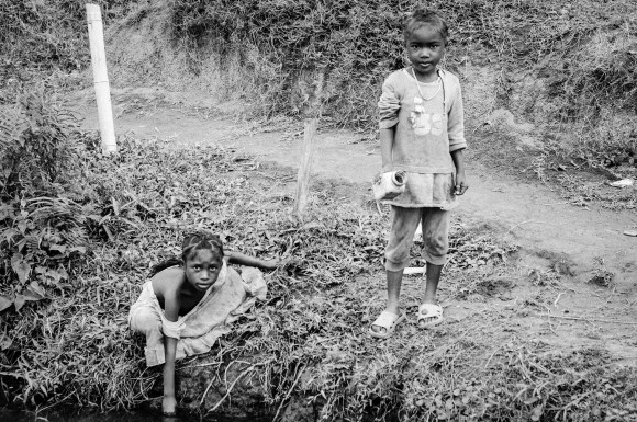 I found these kids along a canal on the way to a village.